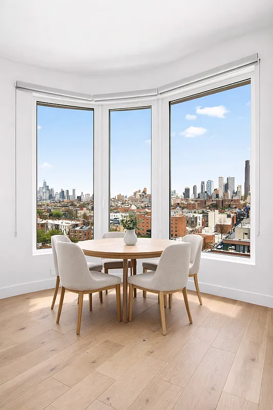130 2nd Street, Unit 10K Brooklyn, NY 11231 - Photo 3 of 20 a balcony with furniture and a view of a city from a chair