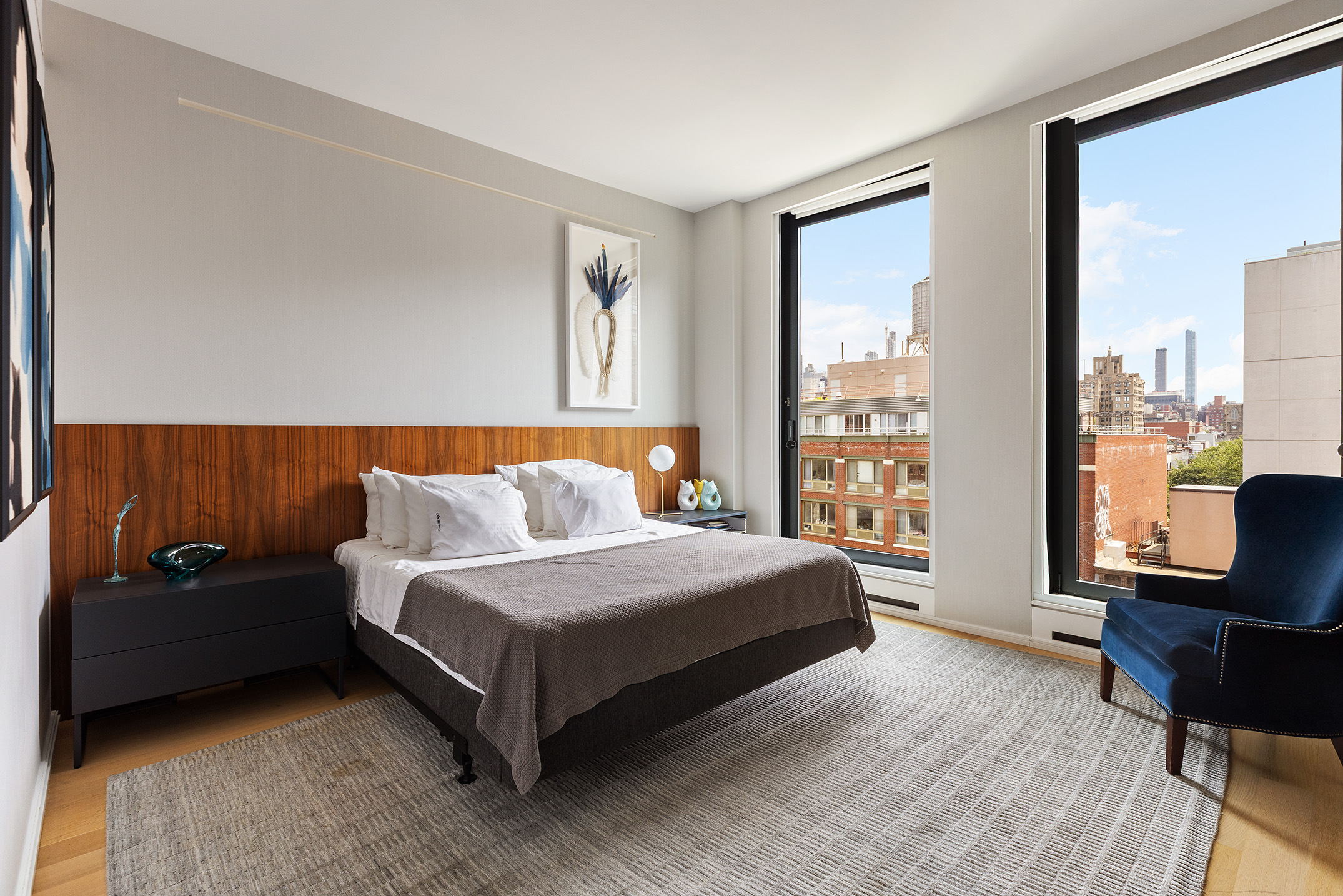 505 West 19th Street, Unit 7B Manhattan, NY 10011 - Photo 14 of 16 a bedroom with a bed and large window