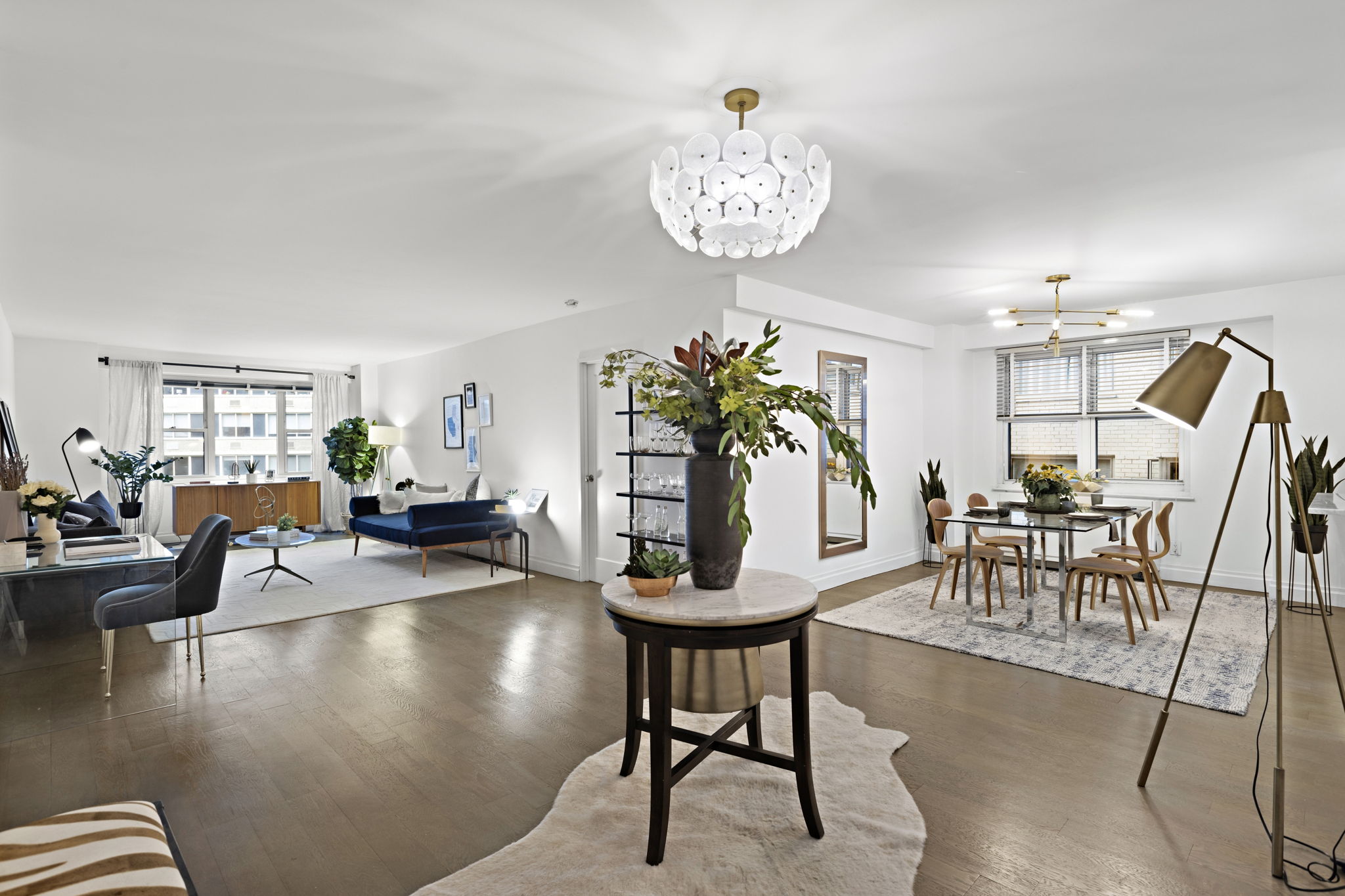 400 East 54th Street, Unit 8A Manhattan, NY 10022 - Photo 3 of 20 a view of a dining room with furniture and wooden floor