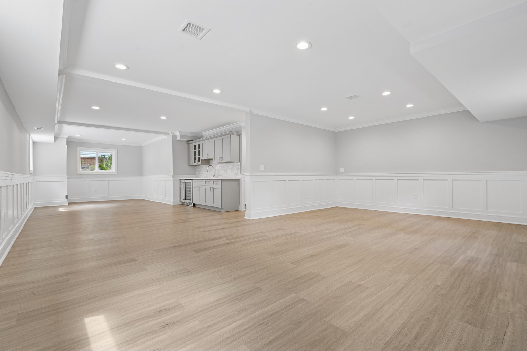 823 River Road Chatham, NJ 07928 - Photo 46 of 60 a view of empty room with wooden floor and kitchen