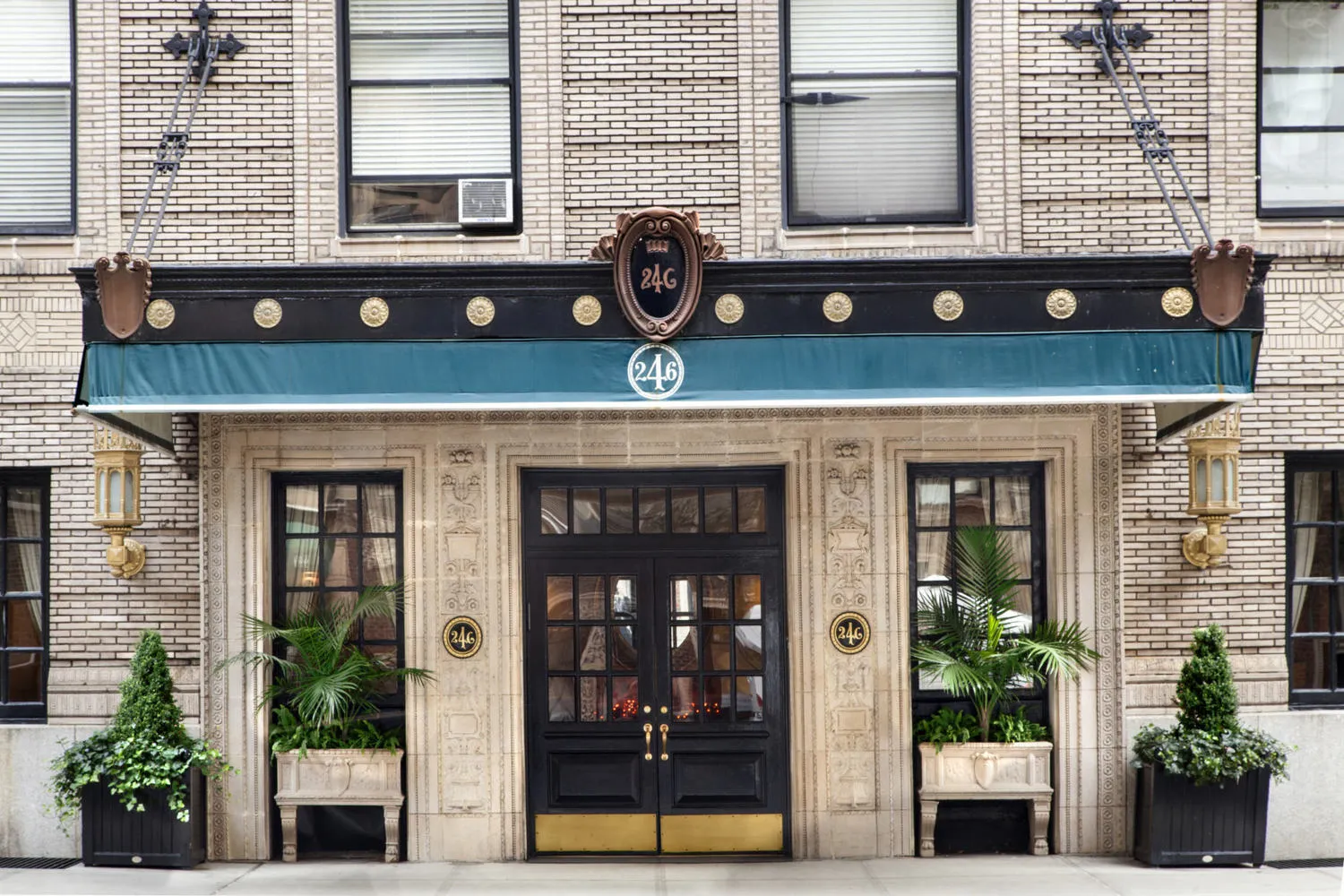 a view of a brick building with large windows