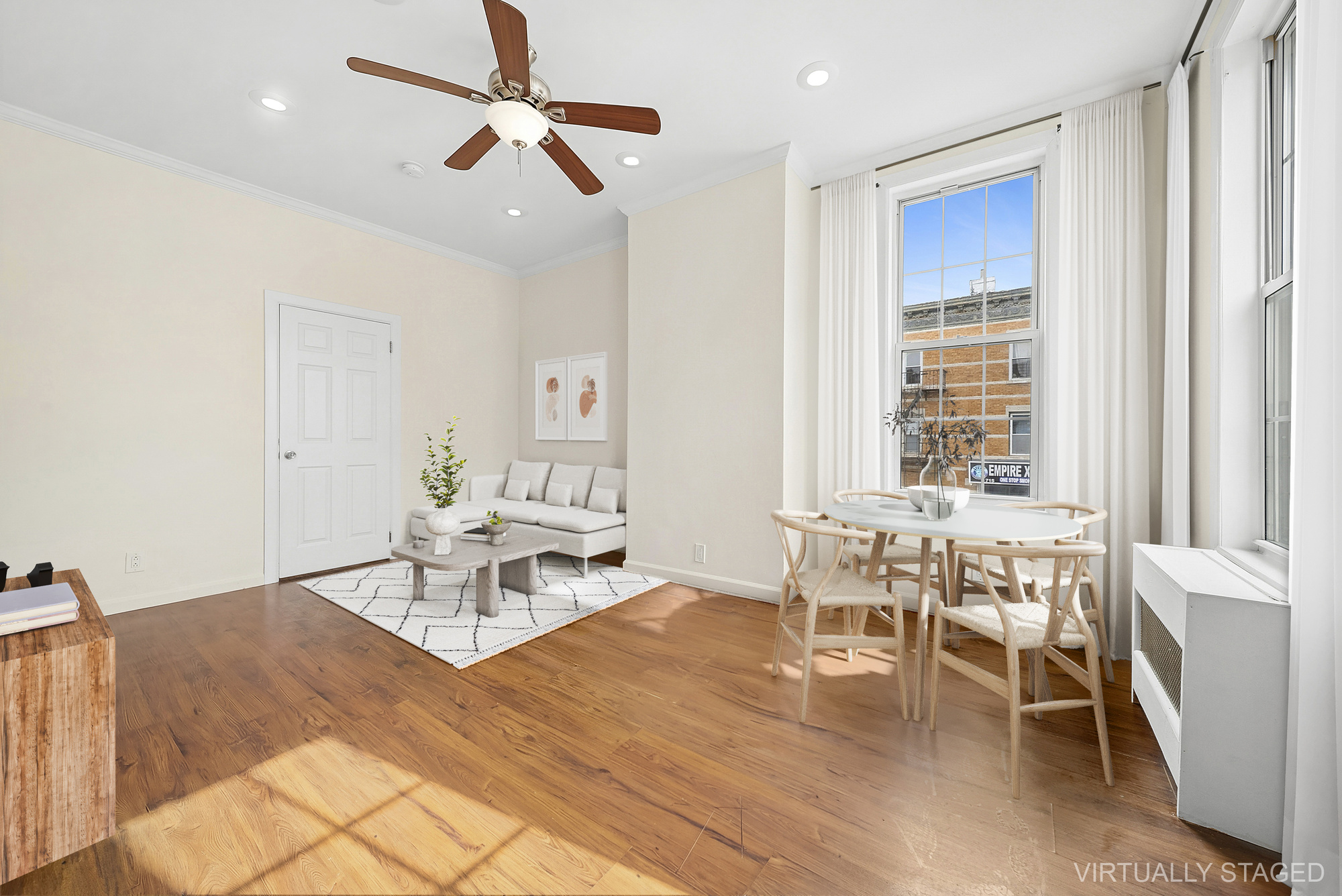 109 Moffat Street, Unit 2F Brooklyn, NY 11207 - Photo 3 of 8 a living room with furniture and a window