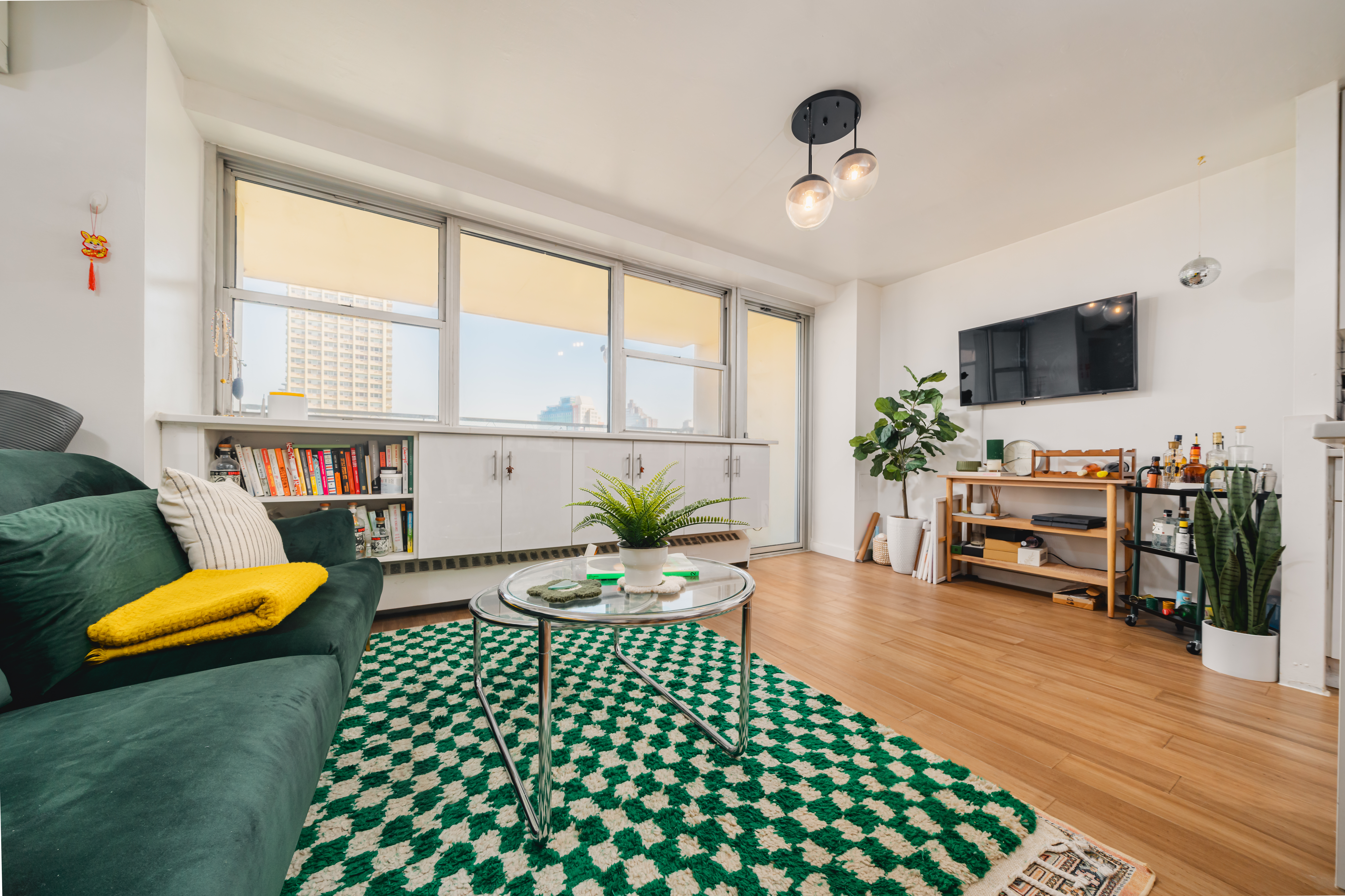 a living room with furniture and a flat screen tv