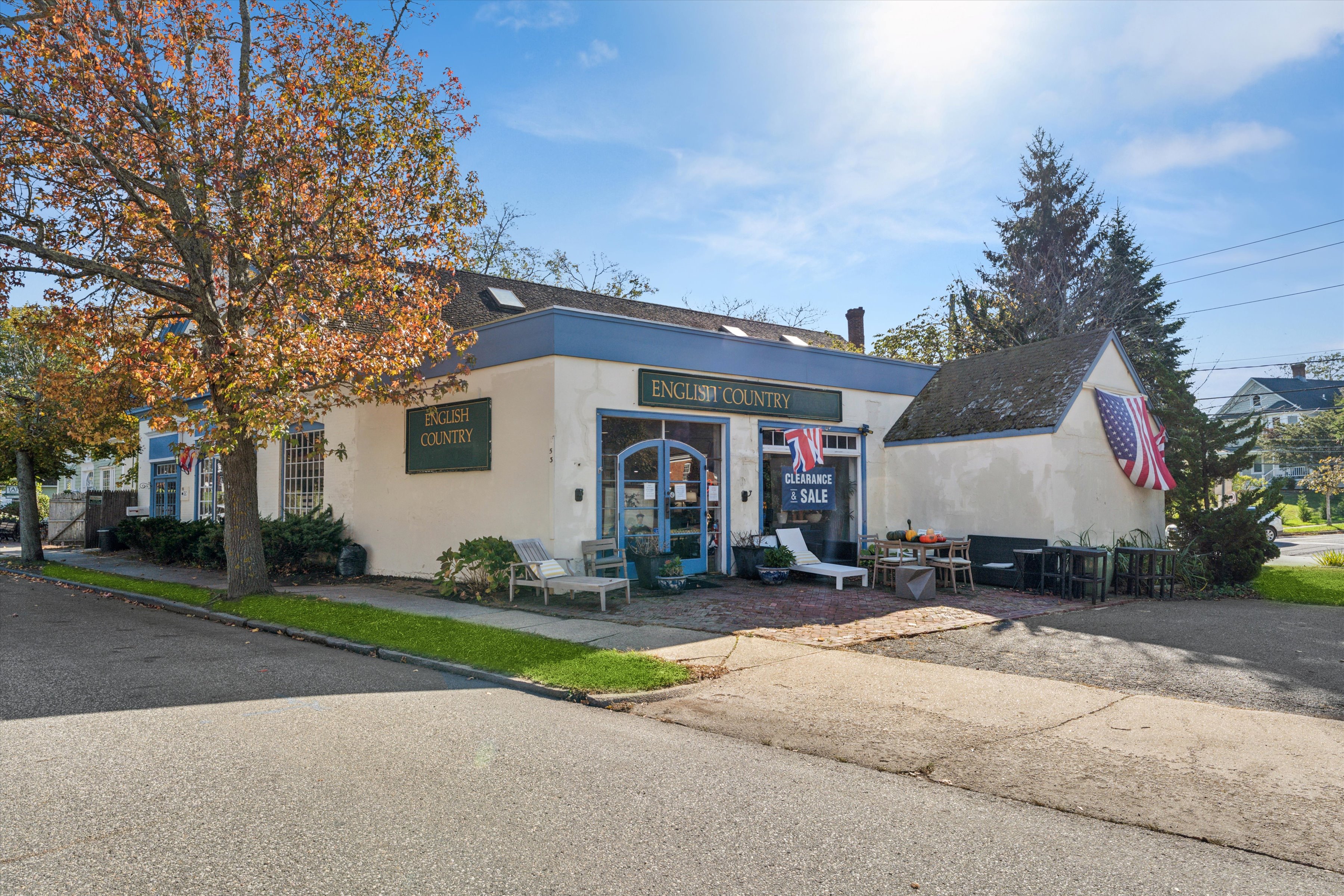 a view of a house with a patio and a yard