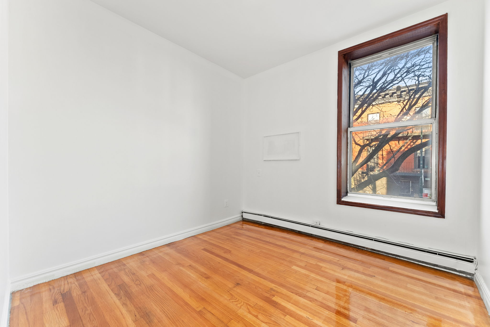 462 3rd Avenue, Unit 2 Brooklyn, NY 11215 - Photo 5 of 8 an empty room with a window