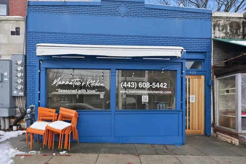 a view of a building with a door and a window