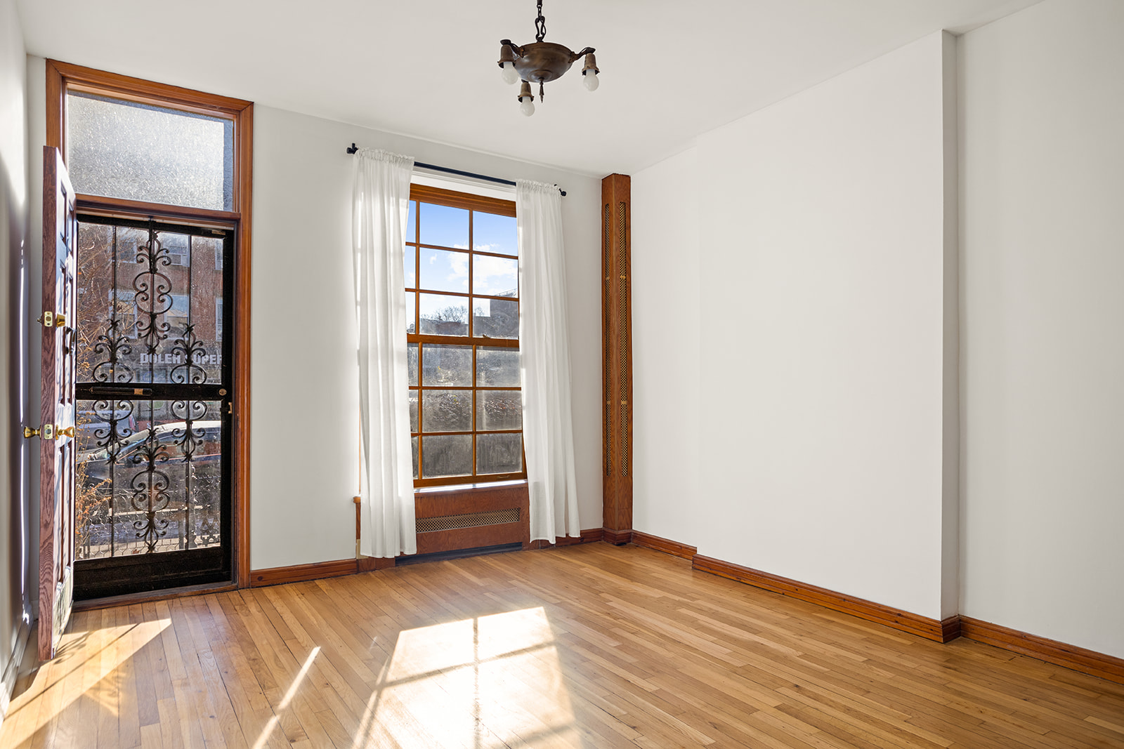 1682 8th Avenue Brooklyn, NY 11215 - Photo 3 of 16 an empty room with windows and closet
