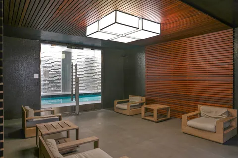 a view of a livingroom with furniture and a large window