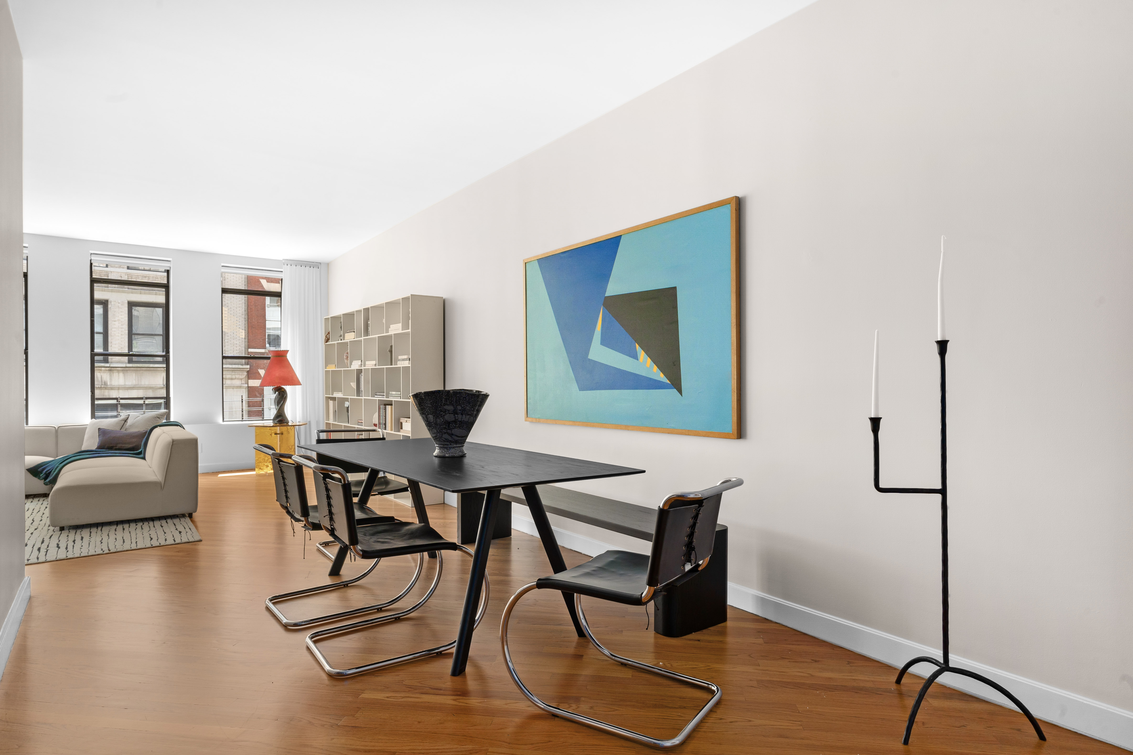 27 East 22nd Street, Unit F4 Manhattan, NY 10010 - Photo 4 of 15 a work room with furniture and wooden floor