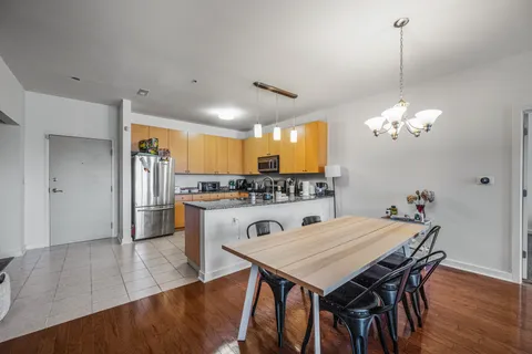a view of a dining room with furniture and wooden floor