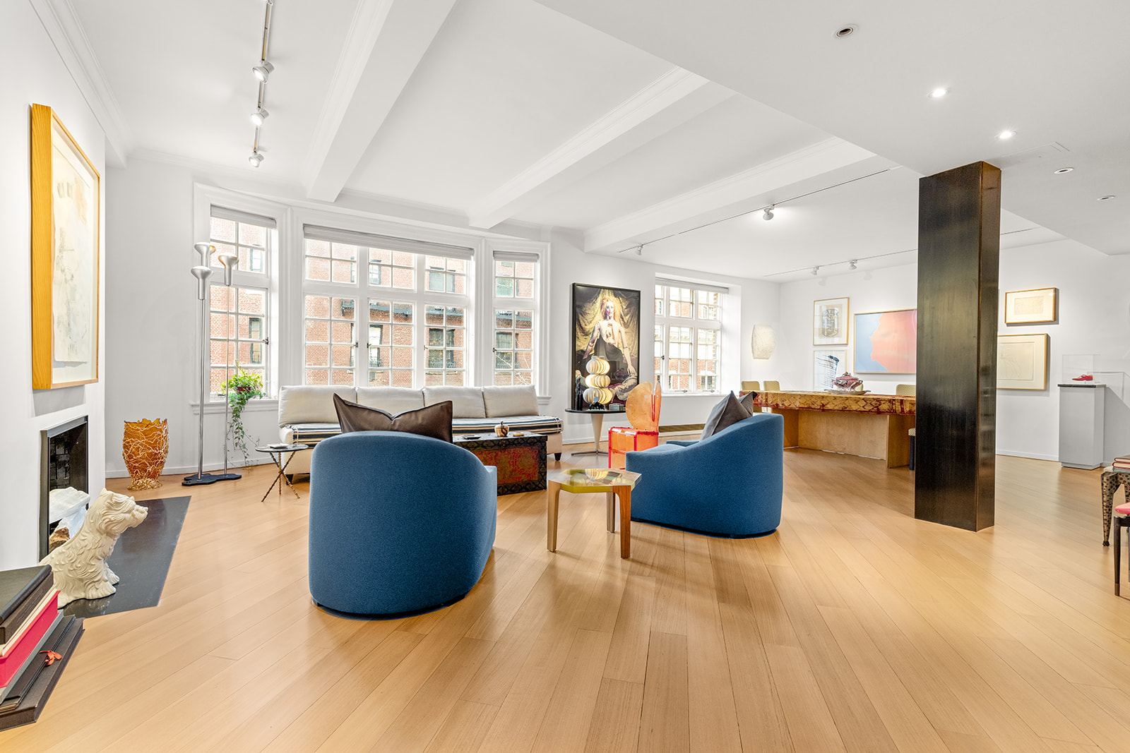 40 East 62nd Street, Unit 6E Manhattan, NY 10065 - Photo 1 of 25 a living room with furniture and large windows