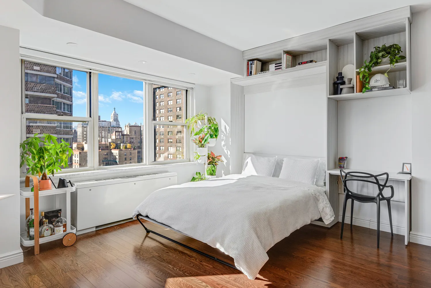 a bedroom with a bed and a table