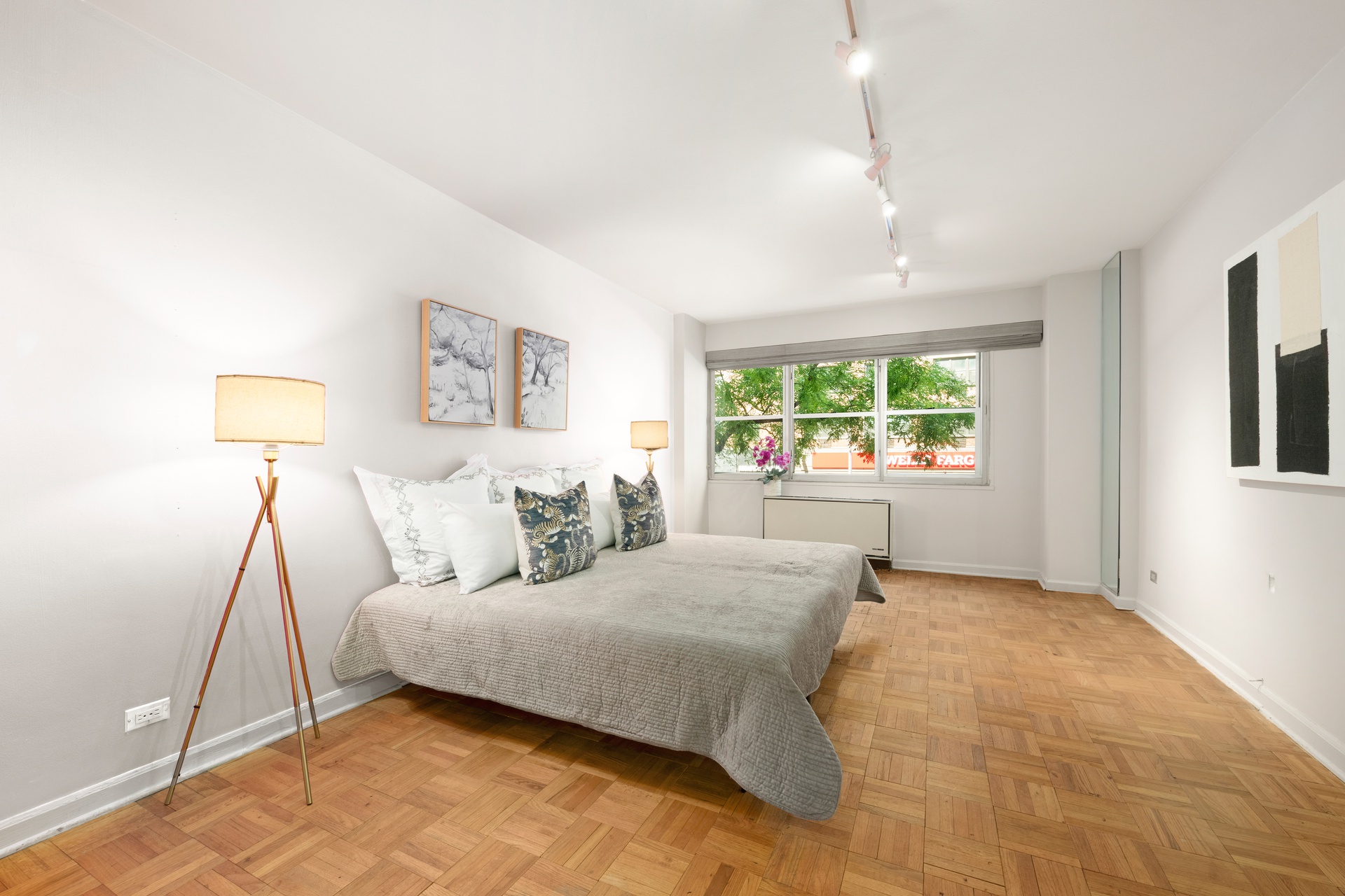 70 East 10th Street, Unit 2P Manhattan, NY 10003 - Photo 7 of 17 a bedroom with a large bed and a window
