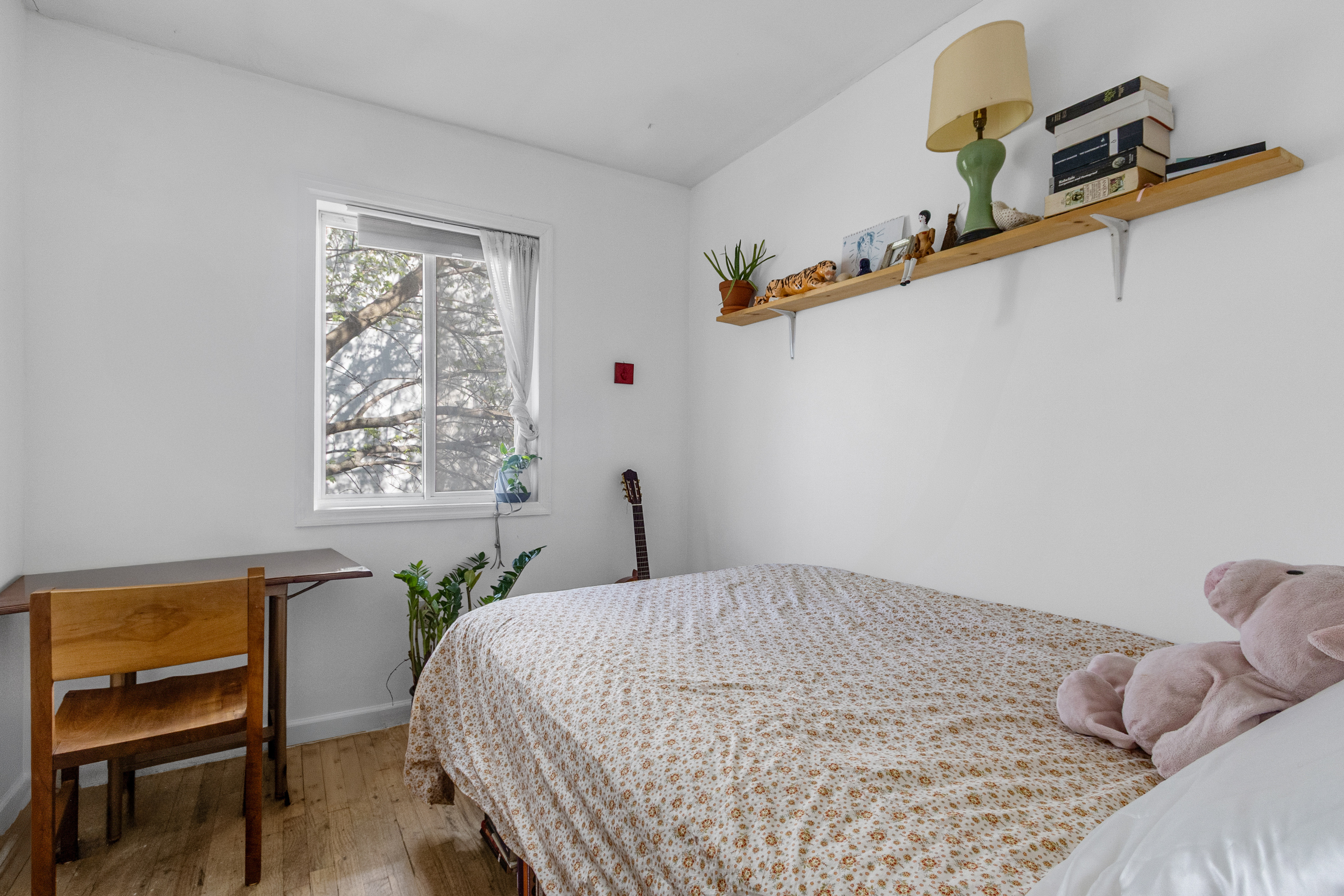 103 A Patchen Avenue Brooklyn, NY 11221 - Photo 14 of 19 a bedroom with a bed and a window