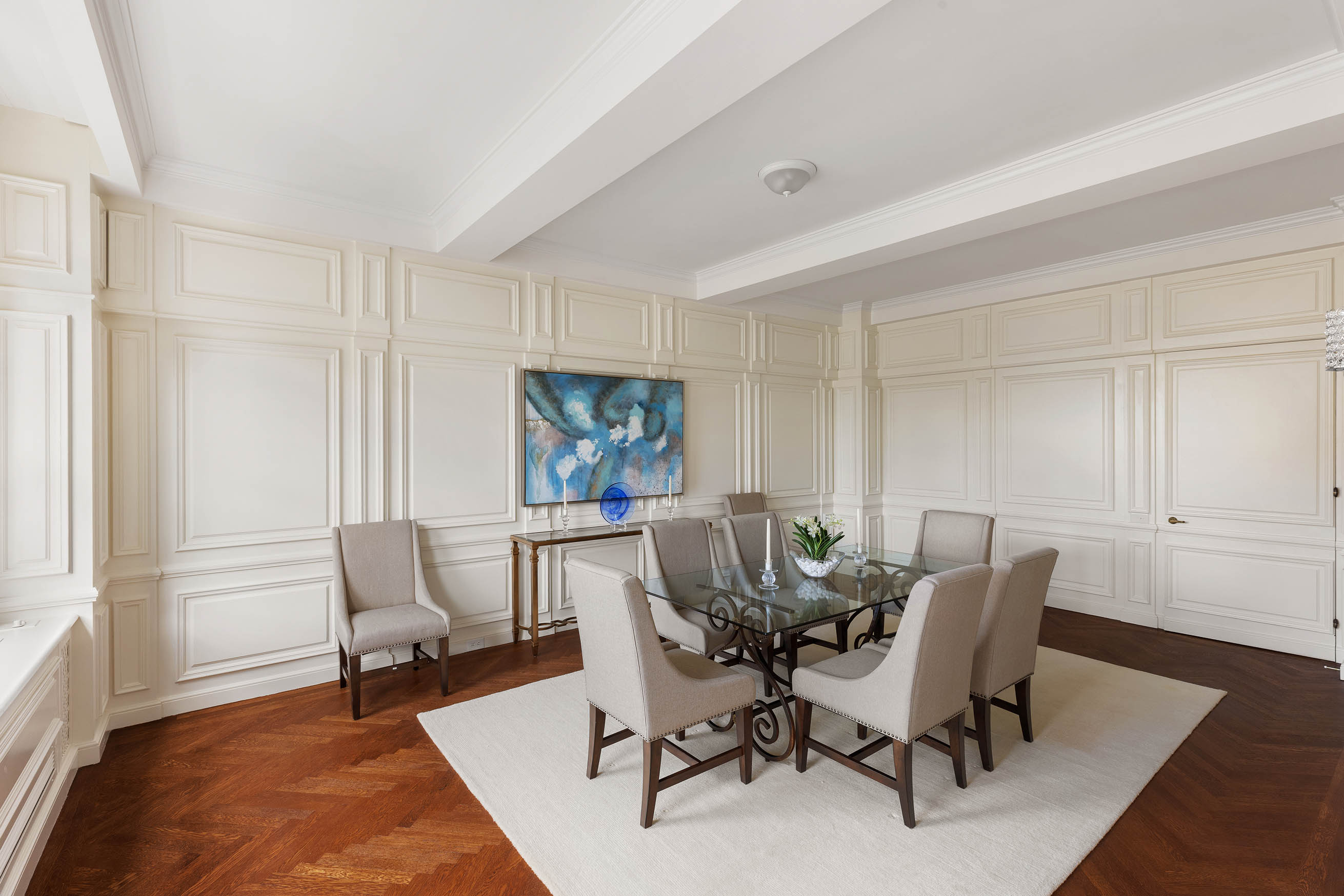 33 East 70th Street, Unit 9C Manhattan, NY 10021 - Photo 4 of 12 a view of a dining room with furniture and wooden floor