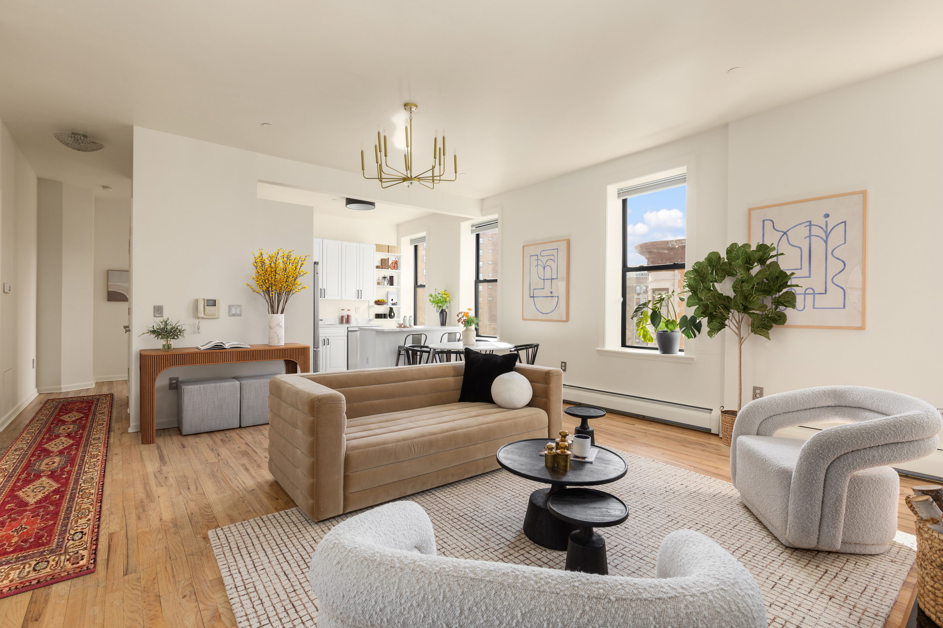 61 Lenox Avenue, Unit 5D Manhattan, NY 10026 - Photo 4 of 14 a living room with furniture and a large window