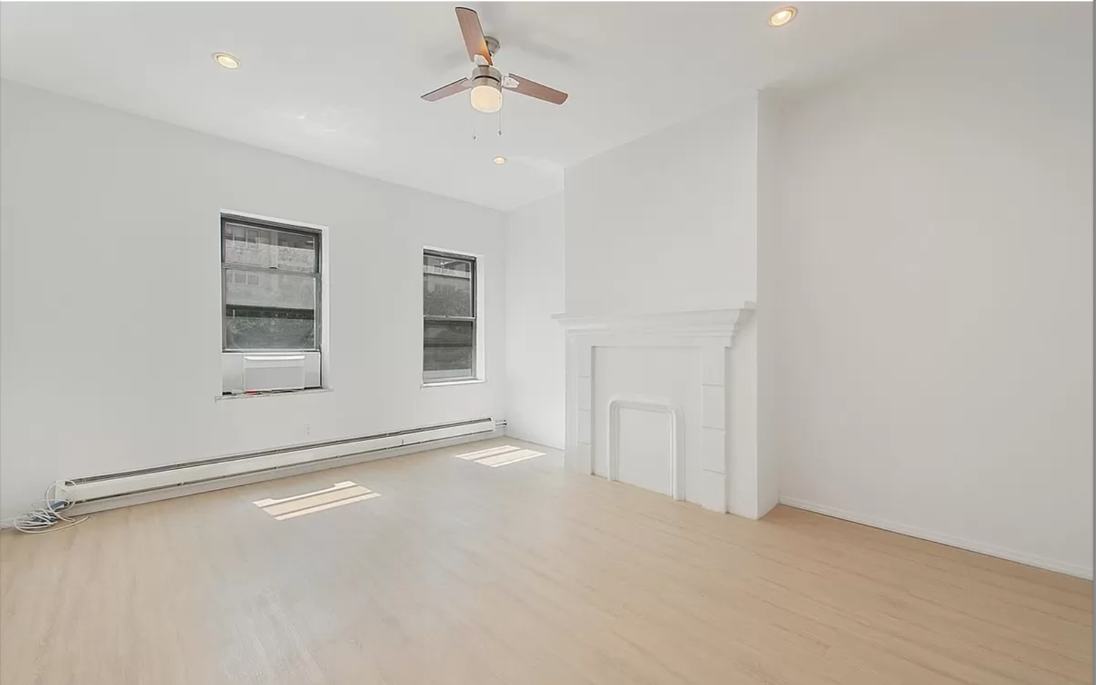 218 3rd Avenue, Unit 2 Manhattan, NY 10003 - Photo 6 of 9 an empty room with windows and closet