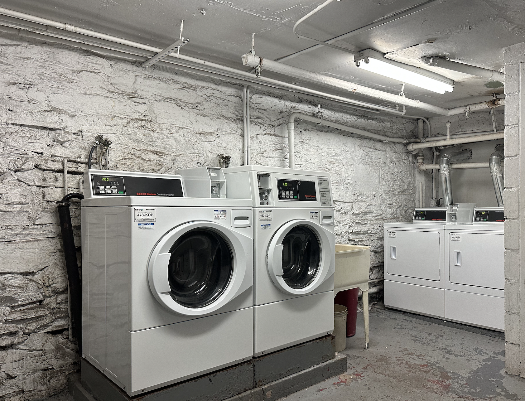 458 West 57th Street, Unit 5FE Manhattan, NY 10019 - Photo 12 of 14 a utility room with dryer and washer