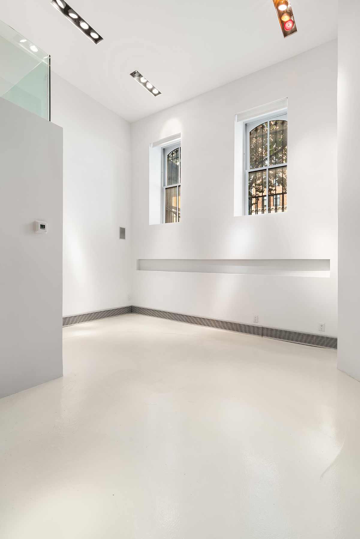 468 West 23rd Street, Unit 1A Manhattan, NY 10011 - Photo 2 of 11 a view of an empty room with a window