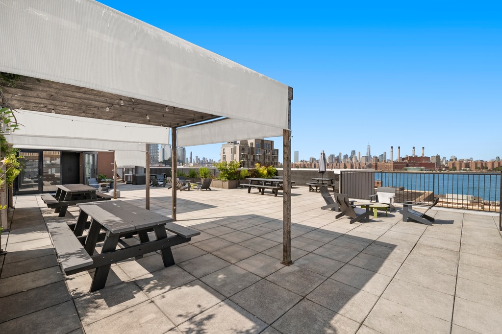 122 West Street, Unit PHA Brooklyn, NY 11222 - Photo 13 of 14 a view of a patio with a table and chairs