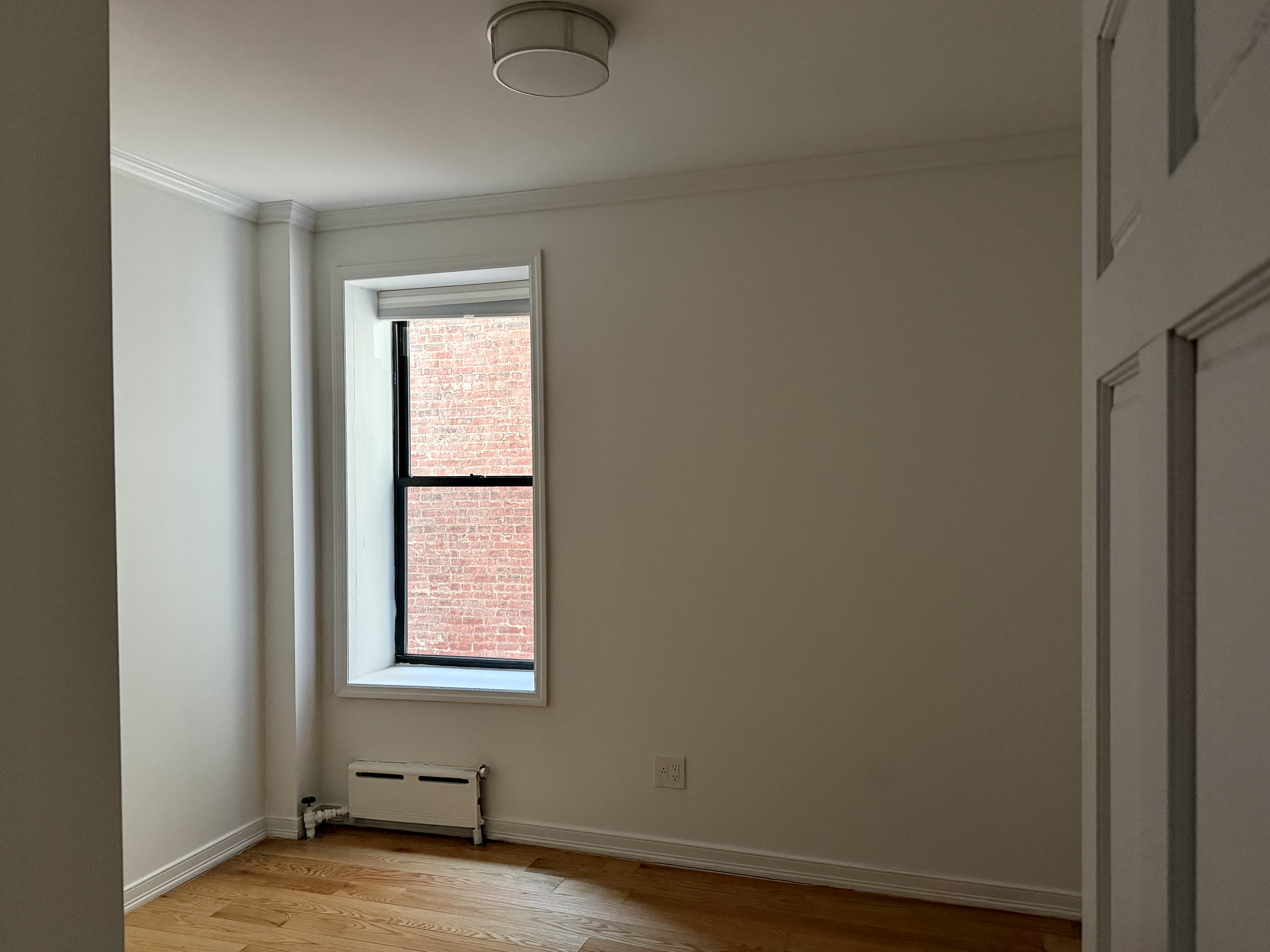 573 6th Street Brooklyn, NY 11215 - Photo 9 of 11 an empty room with a window