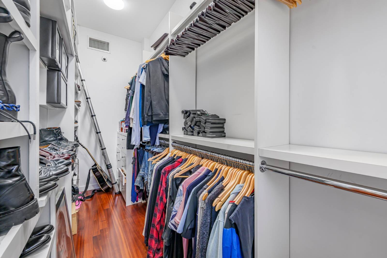 124 East 13th Street, Unit 3 Manhattan, NY 10003 - Photo 18 of 26 a view of walk in closet with clothes and shoes