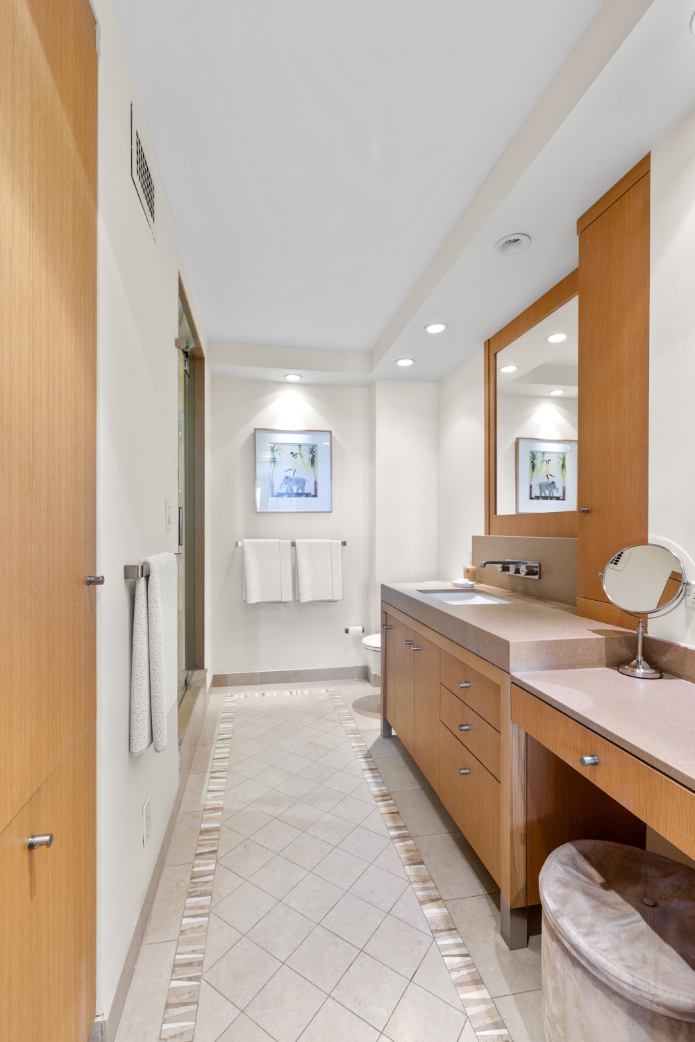 201 West 70th Street, Unit 29KL Manhattan, NY 10023 - Photo 12 of 20 a spacious bathroom with a double vanity sink a mirror and a bathtub