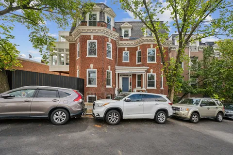 a view of a car parked in front of a house