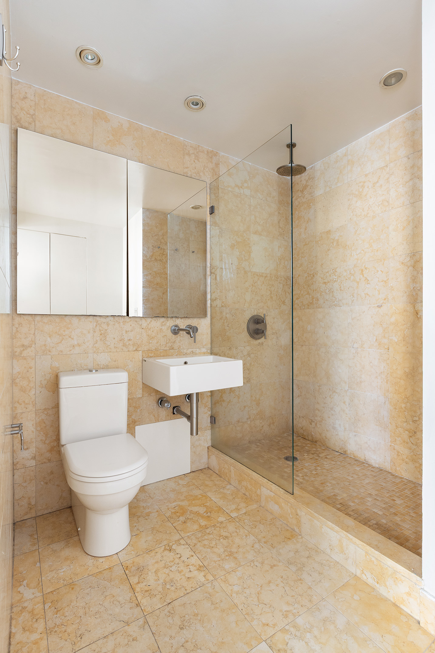 9 Barrow Street, Unit 6D Manhattan, NY 10014 - Photo 5 of 9 a bathroom with a sink toilet and shower