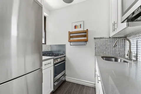 a kitchen with appliances and cabinets
