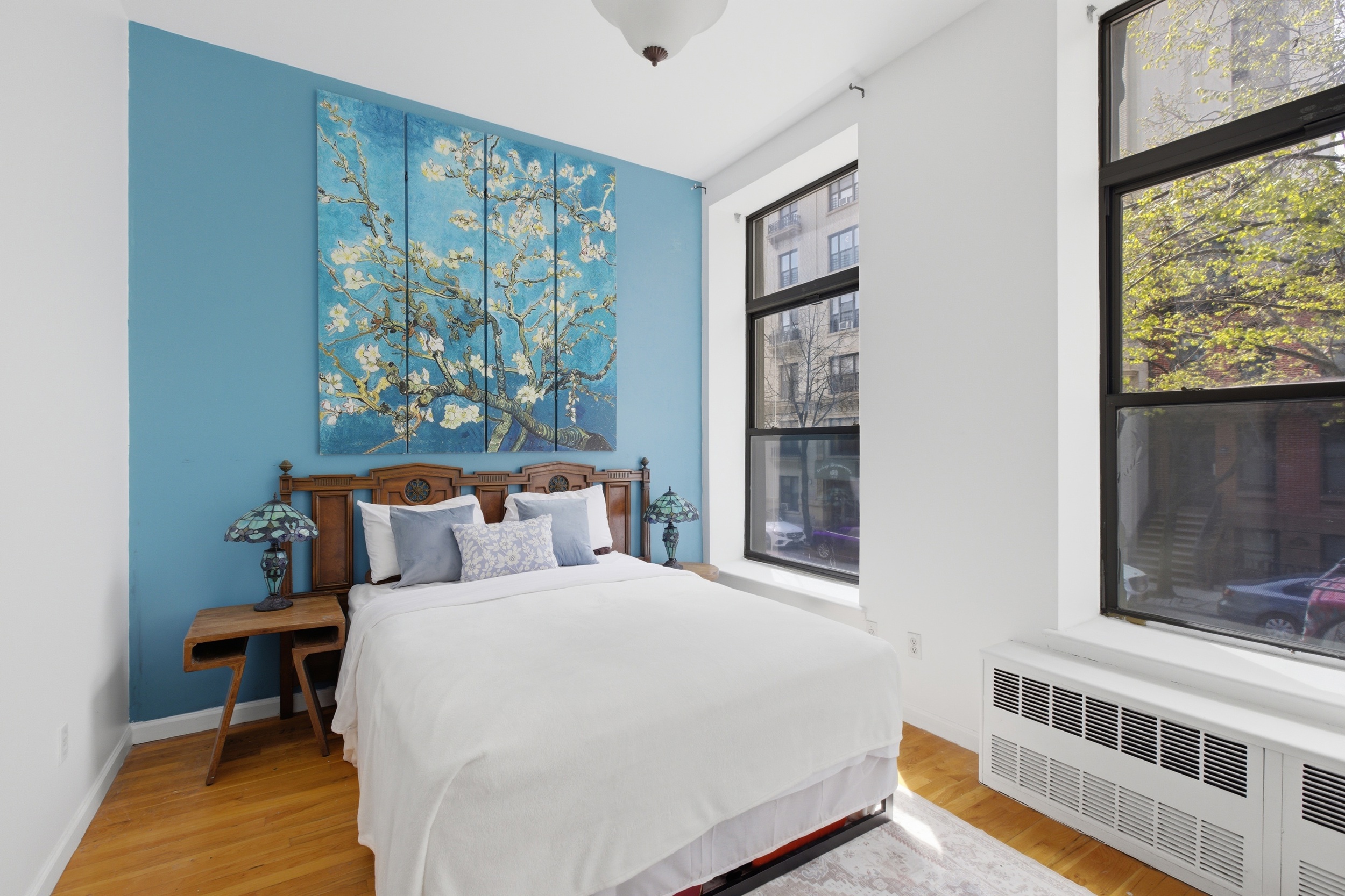 127 West 123rd Street Manhattan, NY 10027 - Photo 11 of 28 a bedroom with a bed and a window
