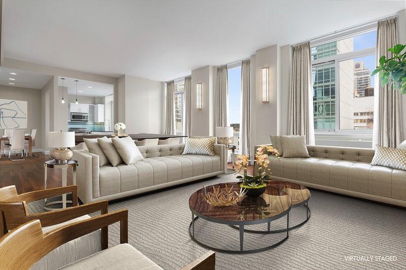 212 East 57th Street, Unit 18A Manhattan, NY 10022 - Photo 1 of 14 a living room with furniture and a large window