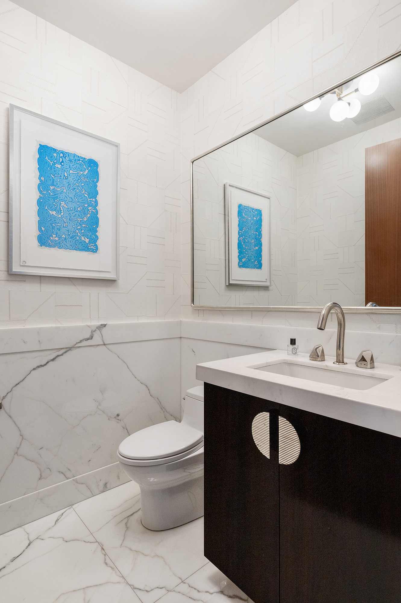 260 Park Avenue South, Unit 6B Manhattan, NY 10010 - Photo 6 of 13 a bathroom with a toilet a sink and mirror