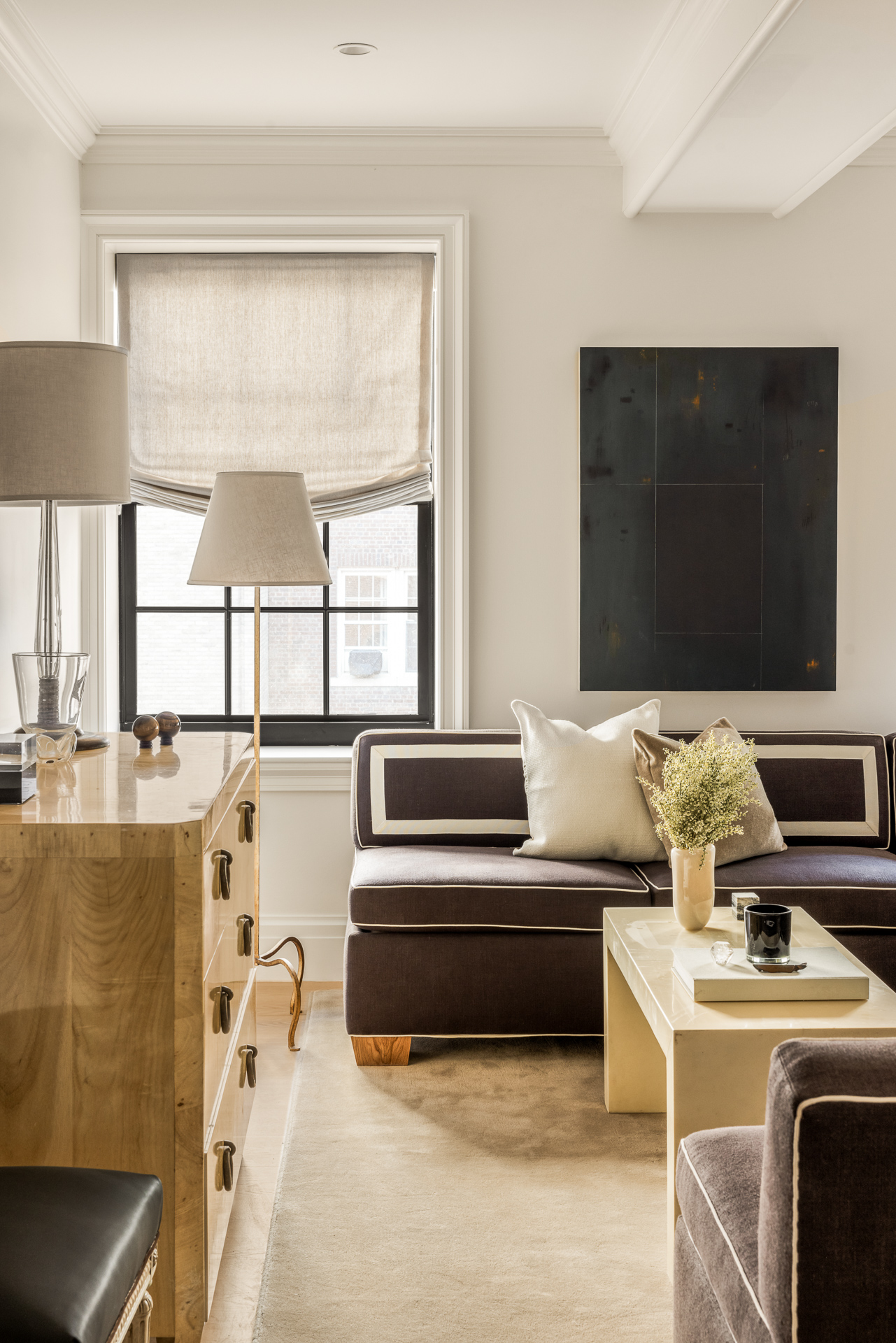 118 West 13th Street, Unit 3 Manhattan, NY 10011 - Photo 8 of 26 a living room with a couch and a flat screen tv