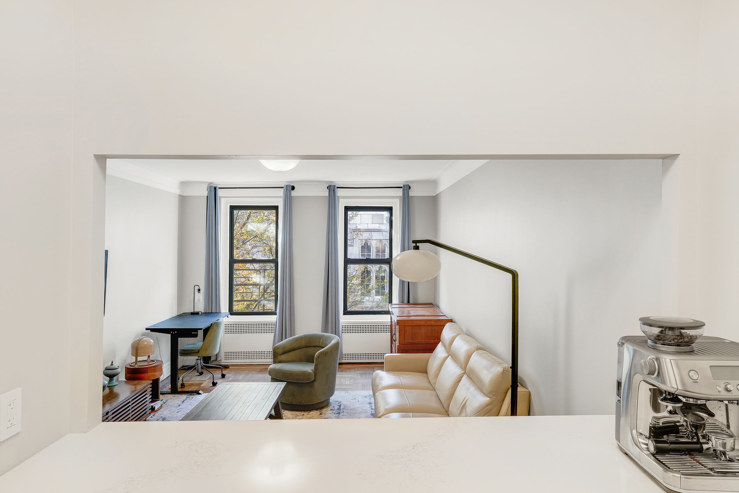 129 West 89th Street, Unit 36 Manhattan, NY 10024 - Photo 7 of 14 a living room with furniture and a flat screen tv