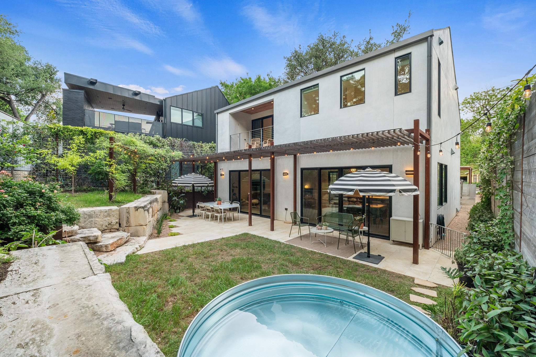 1206 Bickler Road Austin, TX 78704 - Photo 60 of 65 a view of a house with backyard porch and sitting area
