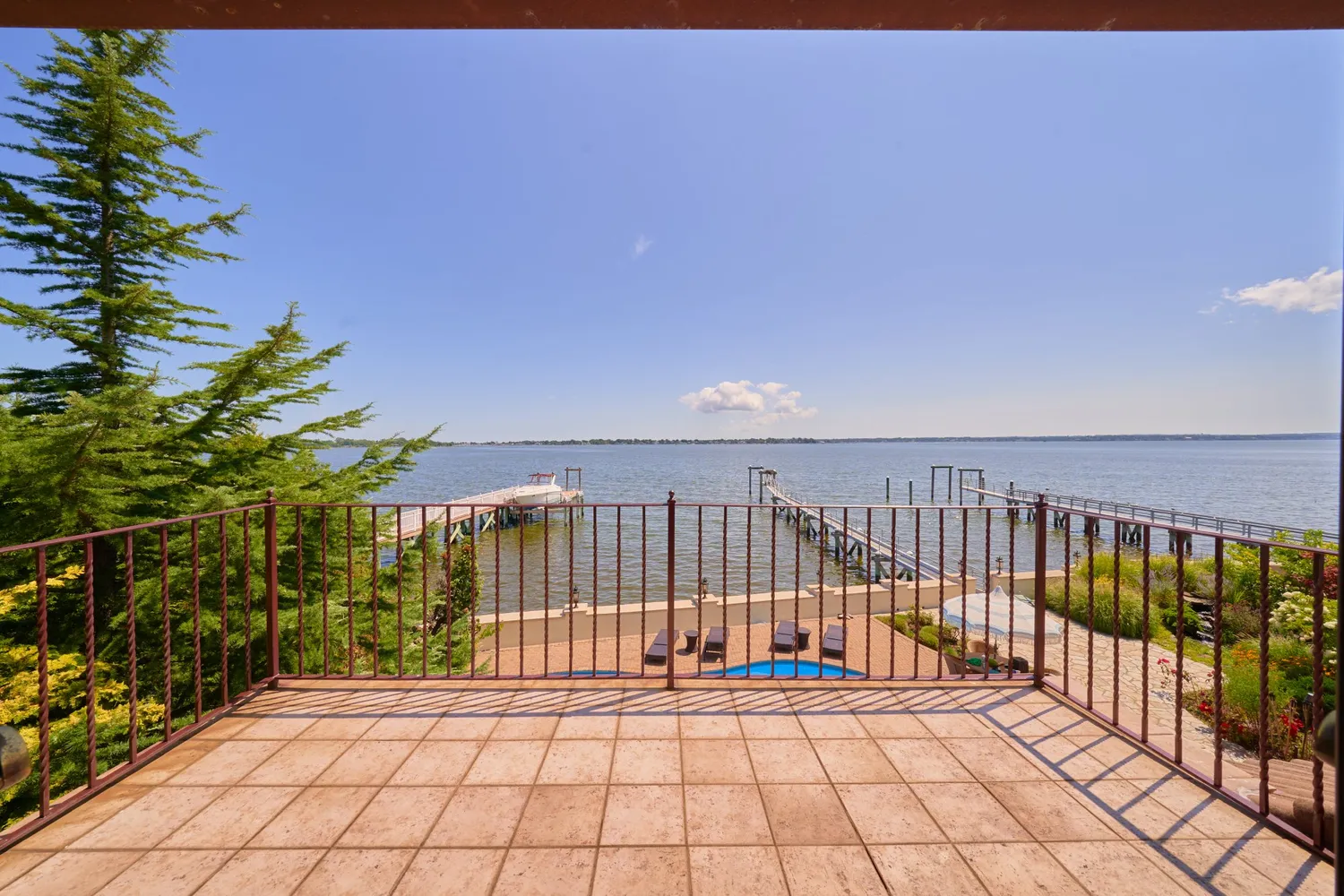 a view of a swimming pool with outdoor seating and plants
