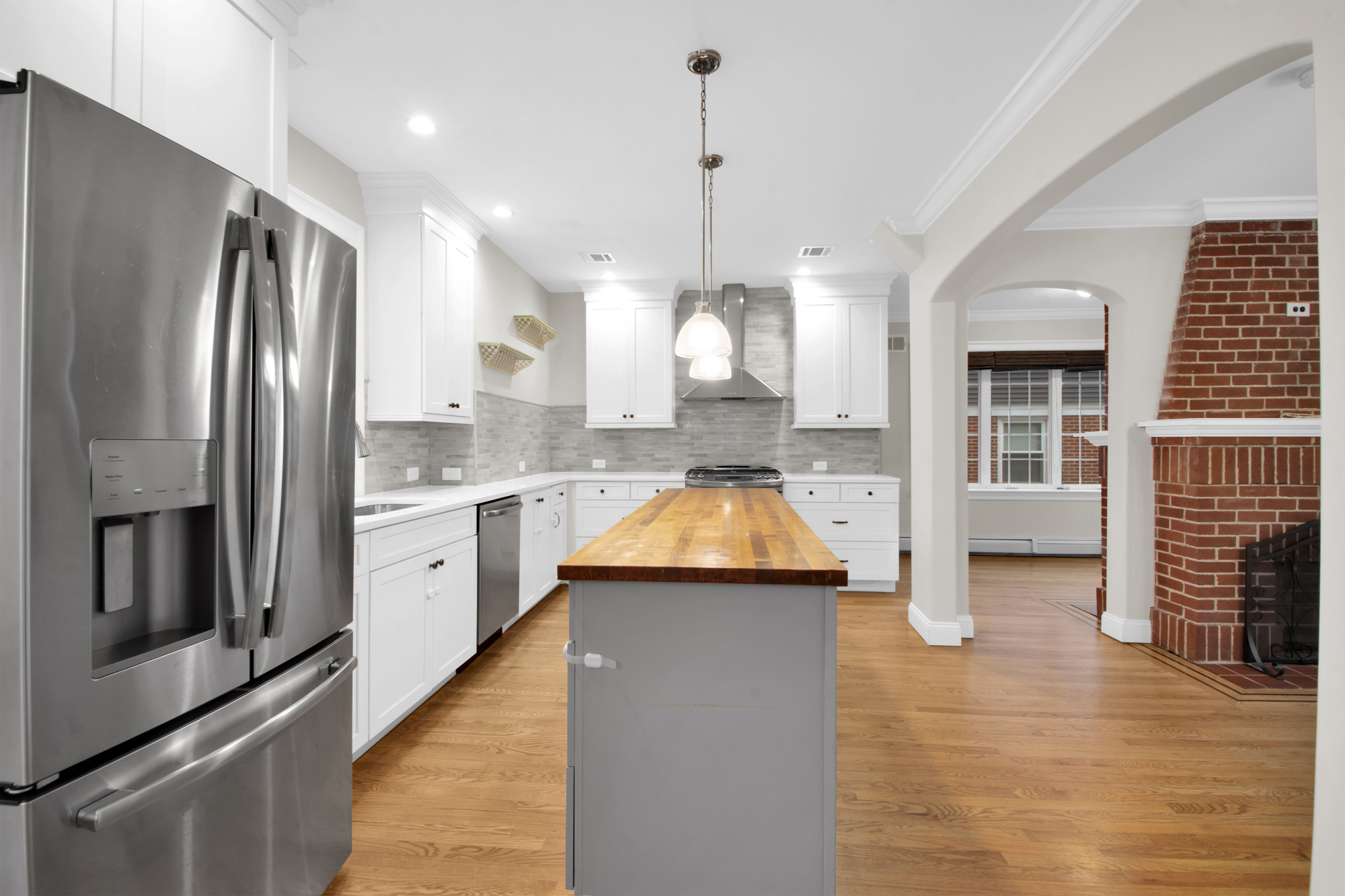 11 Nixon Avenue Staten Island, NY 10304 - Photo 11 of 29 a kitchen with kitchen island a counter top space a sink and stainless steel appliances