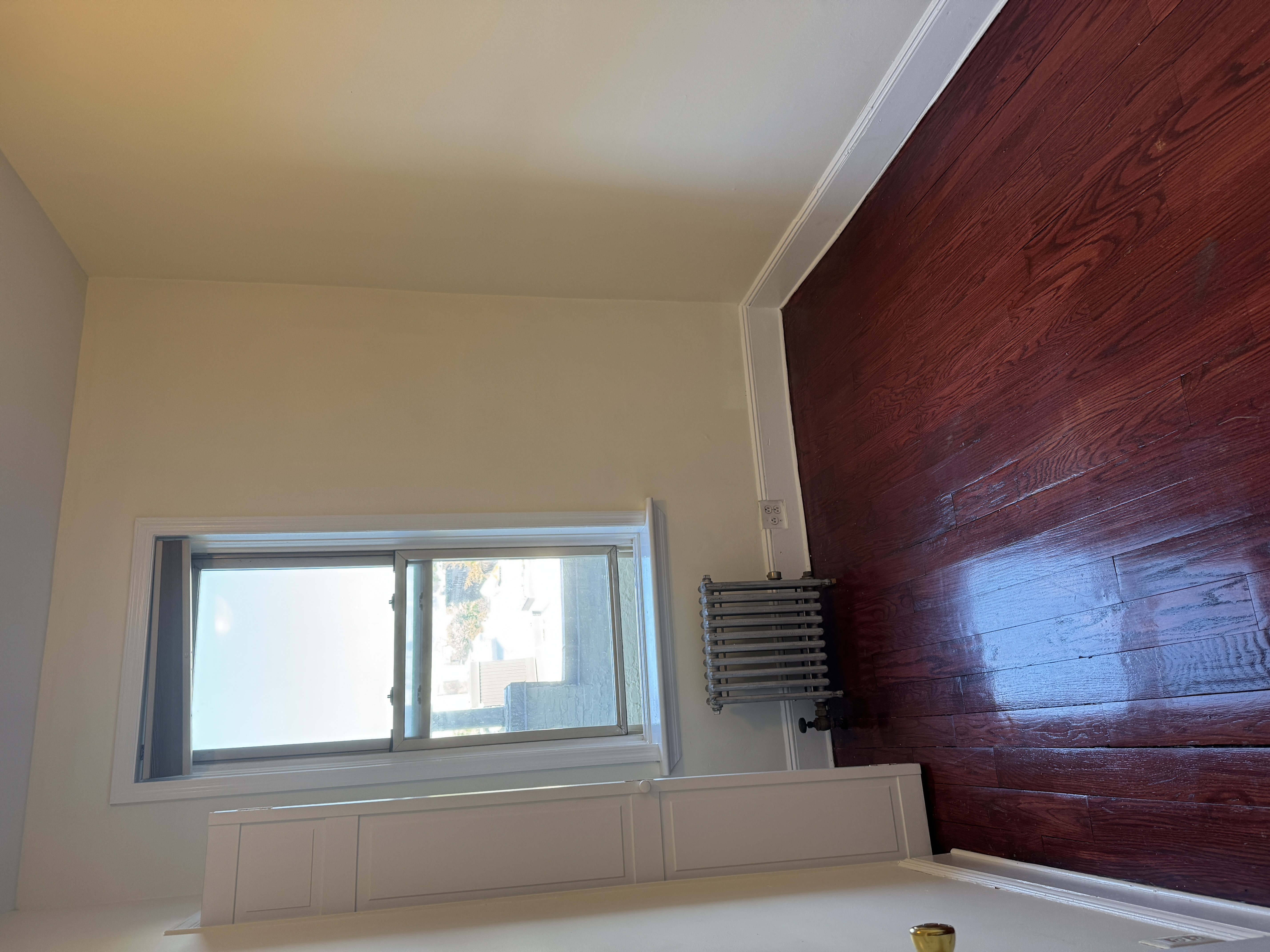 260 Cumberland Street, Unit 21 Brooklyn, NY 11205 - Photo 10 of 13 an empty room with wooden floor and windows
