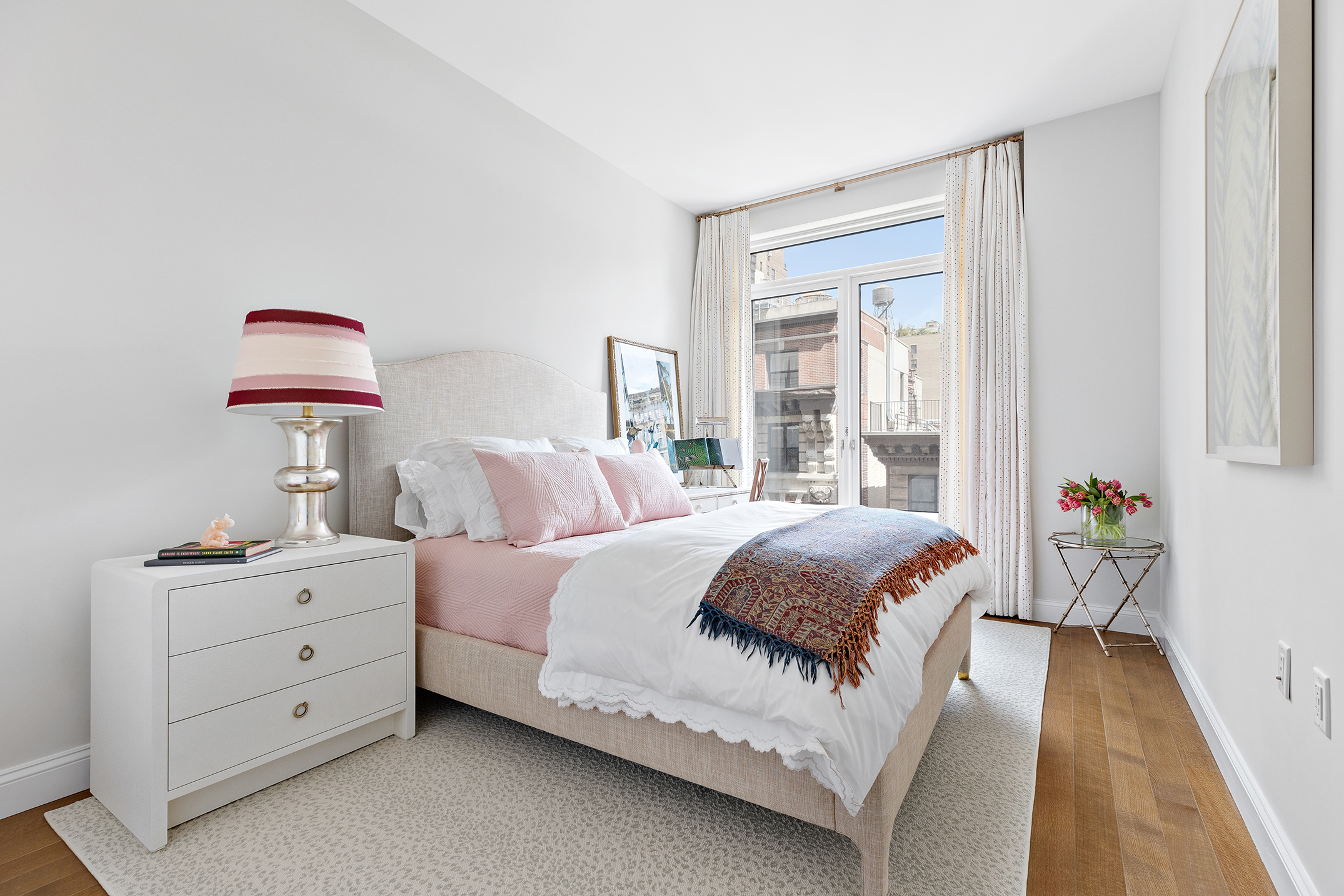 250 West 81st Street, Unit 8B Manhattan, NY 10024 - Photo 10 of 19 a bedroom with a bed and a dresser