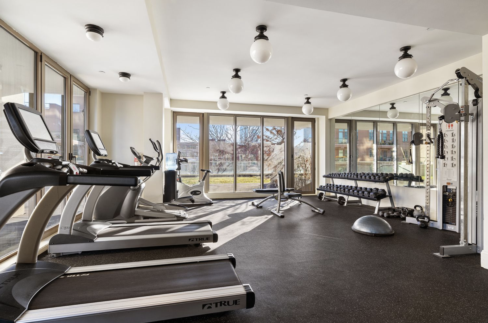 144 North 8th Street, Unit 8C Brooklyn, NY 11249 - Photo 9 of 13 a view of a room with gym equipment