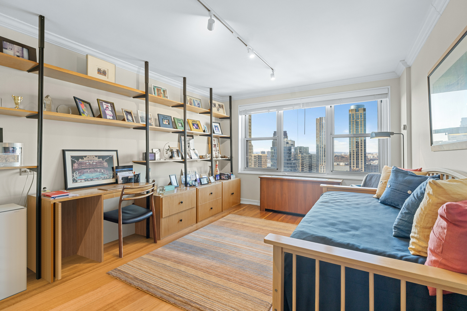 201 West 70th Street, Unit 29KL Manhattan, NY 10023 - Photo 14 of 20 a living room with furniture a large window and kitchen view
