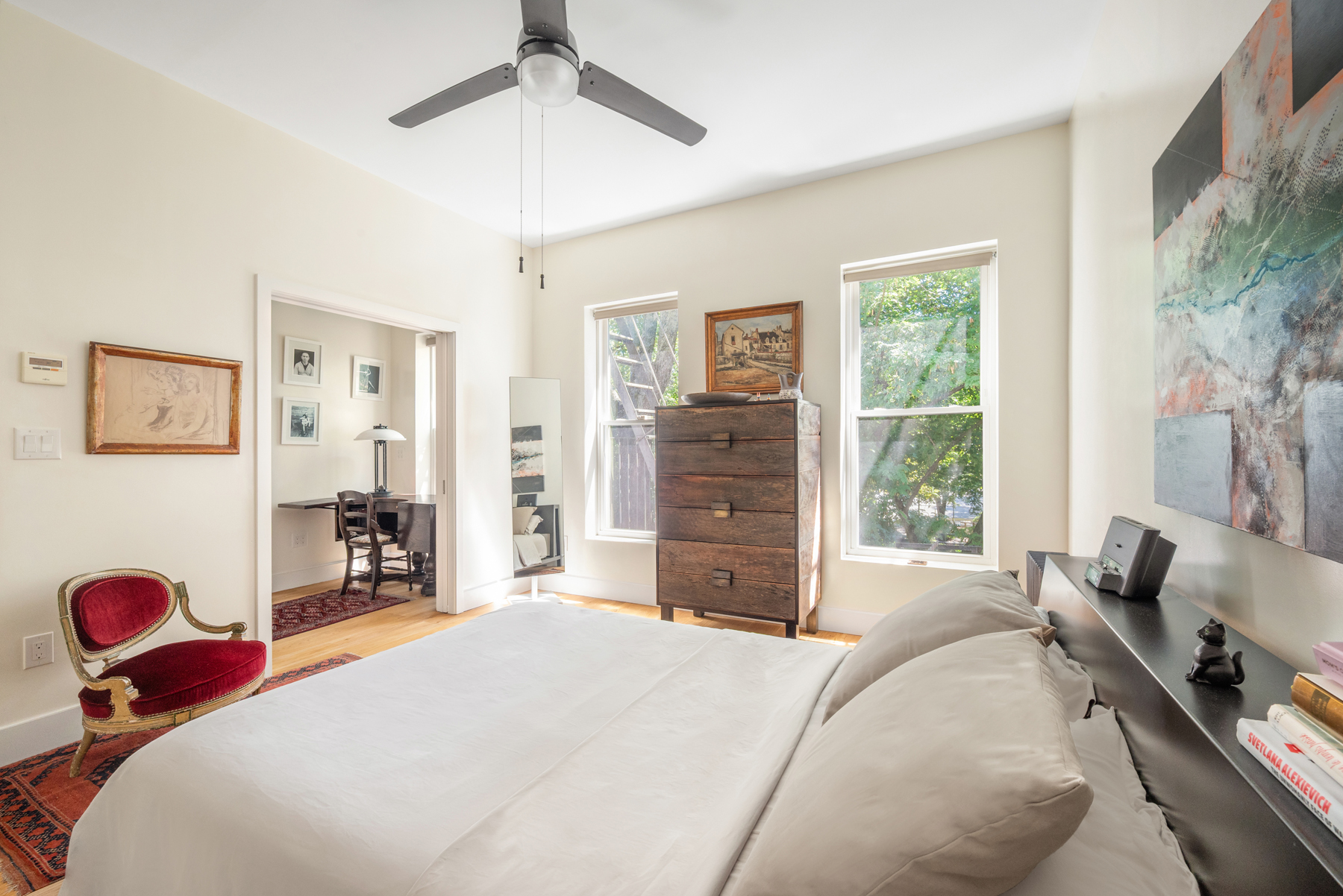 827 Marcy Avenue Brooklyn, NY 11216 - Photo 6 of 17 a bedroom with a bed and dresser with mirror