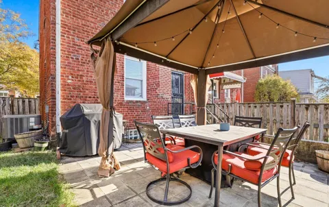 a view of a dinning tables and chairs in the patio