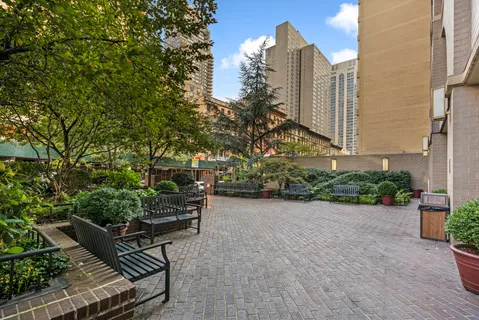 a bench sitting in front of a building
