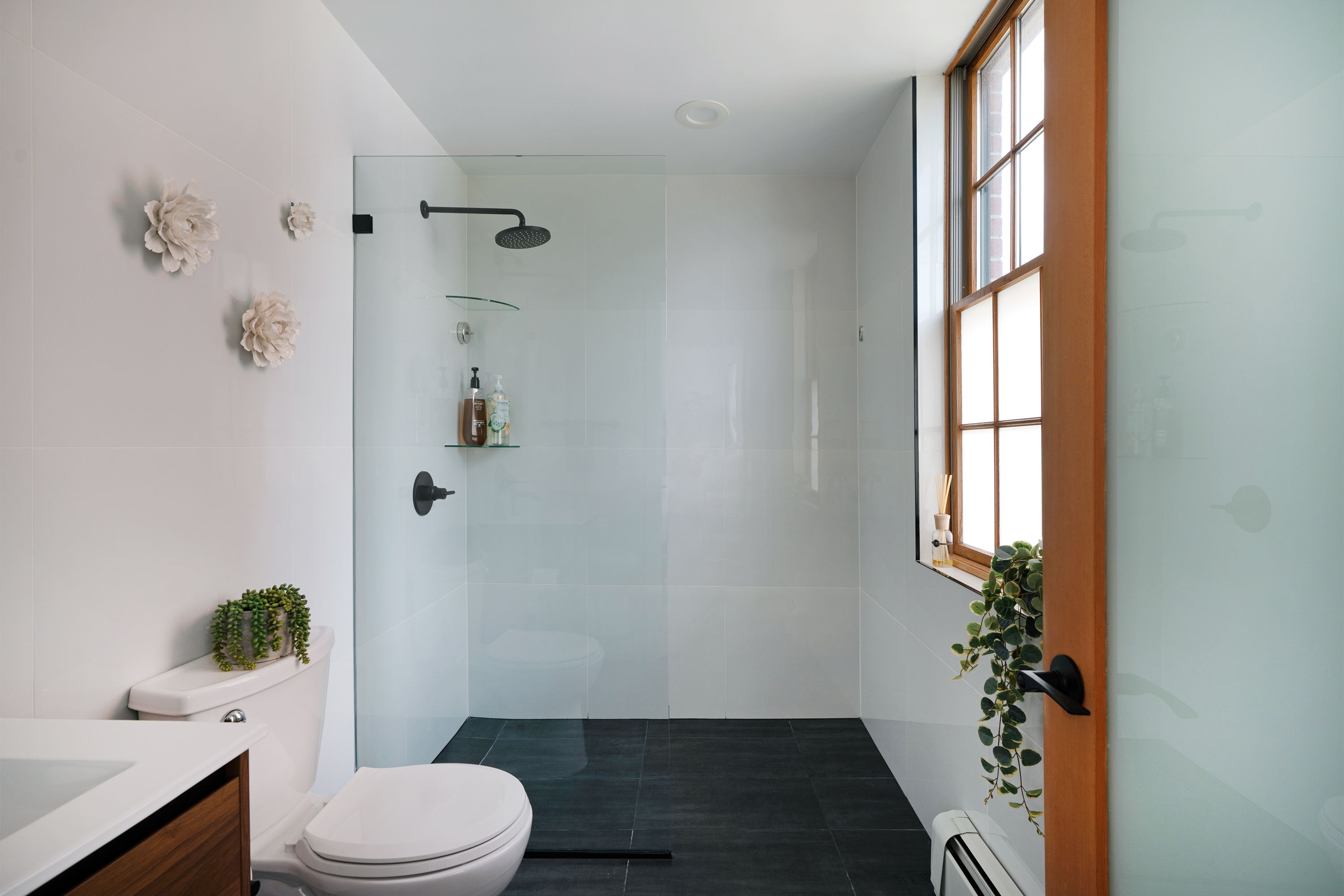 334 Plymouth Street, Unit PH Brooklyn, NY 11201 - Photo 9 of 16 a bathroom with a toilet a sink and shower