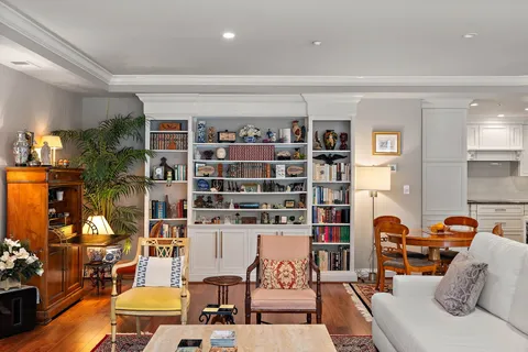 a living room with fireplace furniture and a flat screen tv