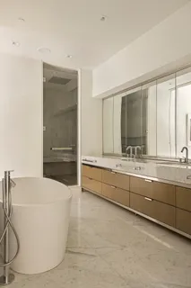 a bathroom with a bathtub and a sink