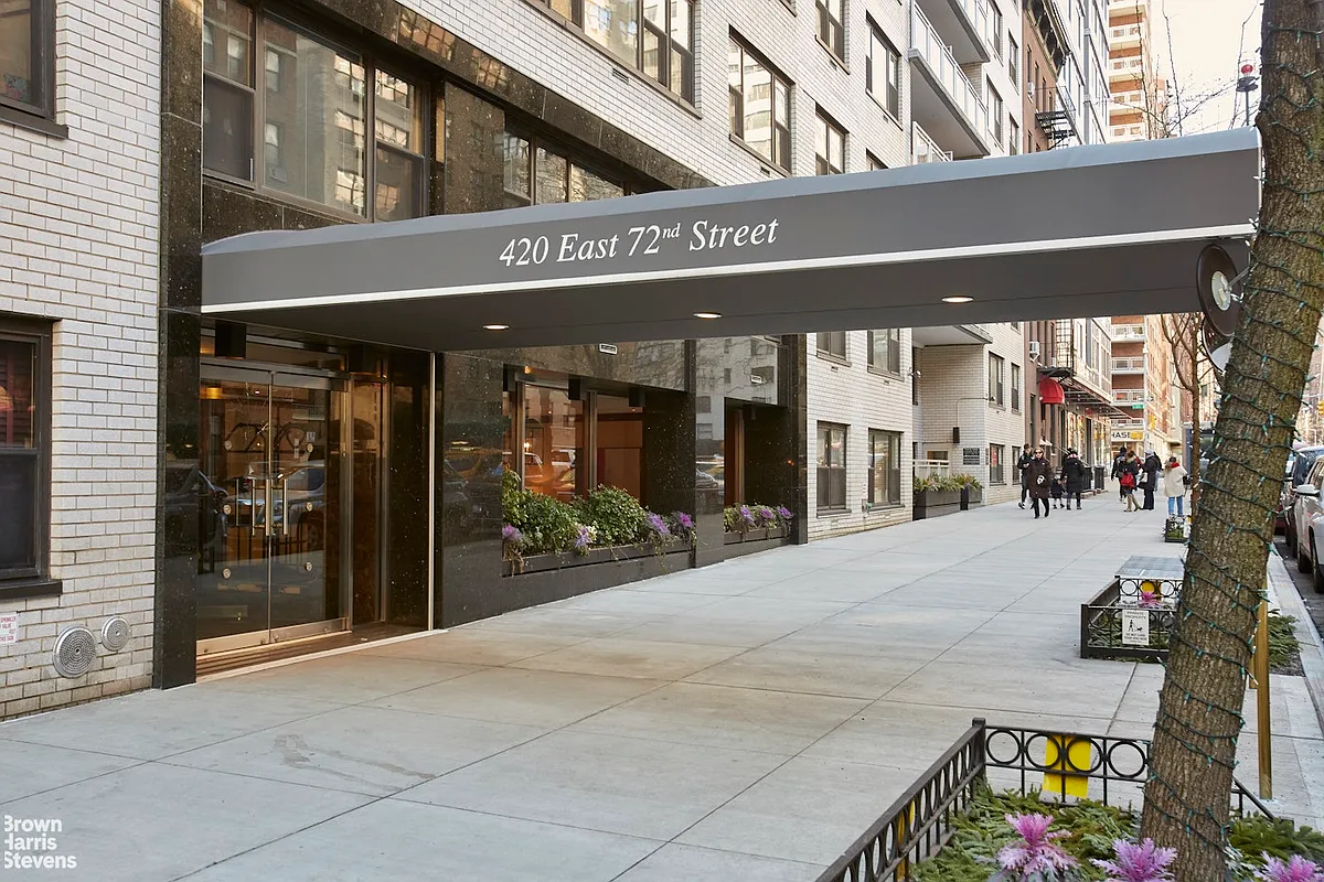 420 East 72nd Street, Unit 2J Manhattan, NY 10021 - Photo 11 of 12 a view of a building with traffic signal lights