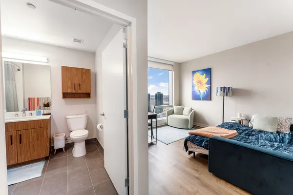 a living room with furniture and a large window